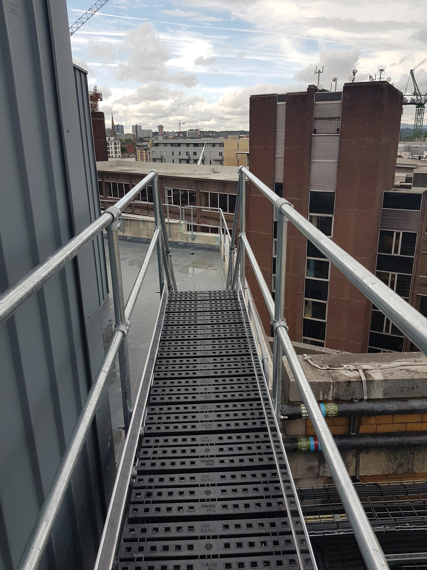 Rooftop walkway with guardrail